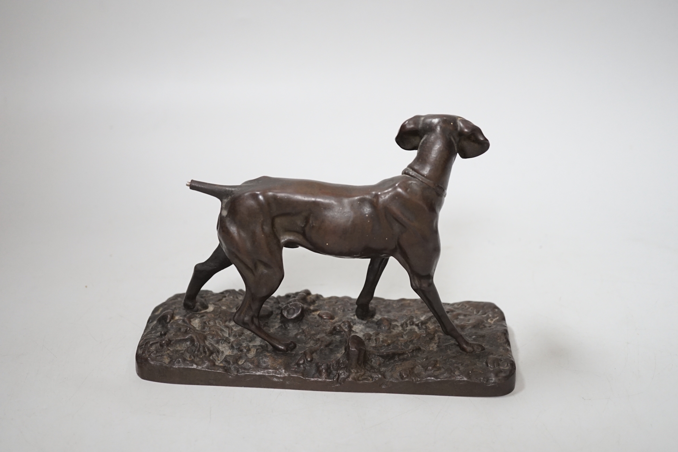 After Pierre-Jules Mêne (1810 – 1879) a patinated cast iron hound and a similar small bronze figure of a greyhound, the largest 18cm wide